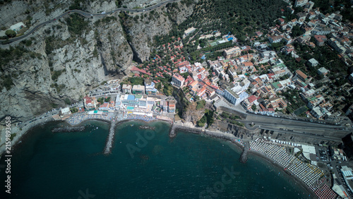 High angle aerial view of Meta di Sorrento beach and breakwaters