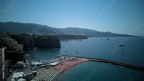 Low altitude drone view of Meta di Sorrento beach and pier - Italy