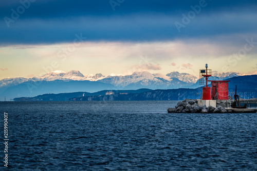 Trieste in winter. Between the sea, snow-capped mountains, and historic monuments.