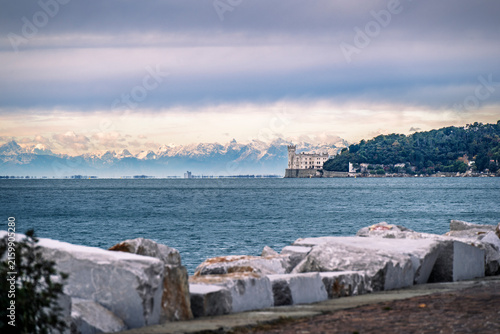 Trieste in winter. Between the sea, snow-capped mountains, and historic monuments.
