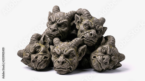 Group of Stone Gargoyle Head Sculptures Isolated on White Background, Gothic Demon Face Statues for Halloween Mythical Creature Decor Concept