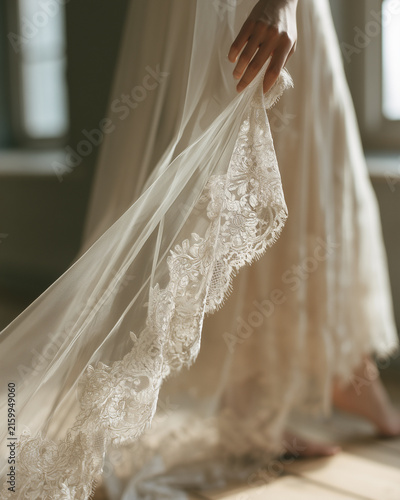 Close-up of delicate lace trim on bridal veil.