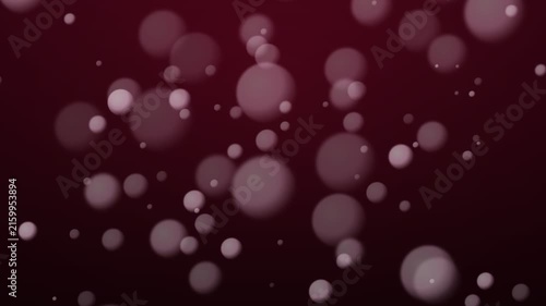 Soft pink bokeh bubbles floating gently on deep burgundy background