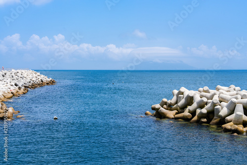 Harbor Channel Entrance Flanked by Two Concrete Tetrapod Breakwaters