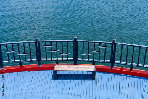 High Angle View of Circular Blue Observation Deck with Wooden Bench