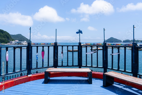Circular Coastal Viewing Deck with Benches and Fish Railing Ornaments