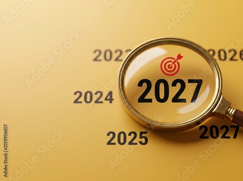 Magnifying Glass Focusing on Year 2027 with Target Icon, Future Planning and Business Strategy Concept