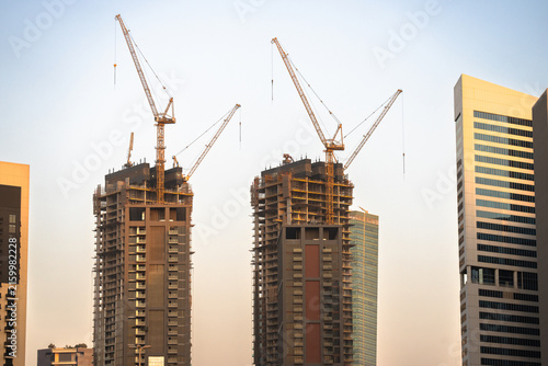 фотографія Construction of high-rise buildings, maintaining safety regulations in the city