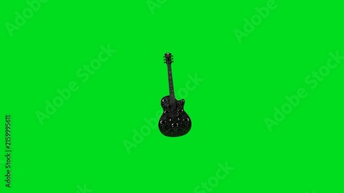 A detailed black electric guitar isolated against a vibrant green background