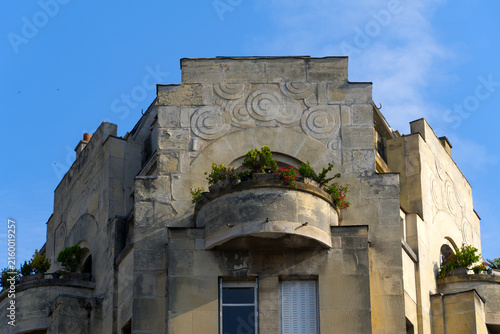 Cityscape with close-up of facade with balcony and flower decoration at French city of Rouen on a summer morning. Photo taken July 14th, 2026, Rouen, Normandie, France.