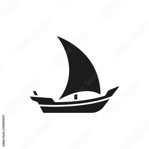Black silhouette of traditional dhow sailboat.