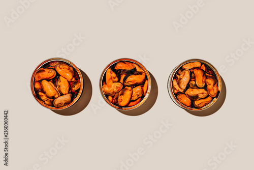 three tins of mejillones en escabeche in a row