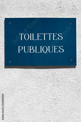 French public toilets sign with copy space on white wall