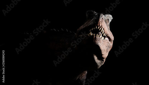 A close-up image of a T-Rex dinosaur with jaws open