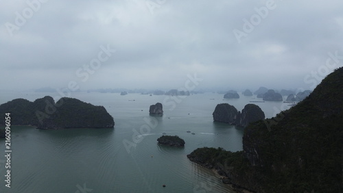 Obraz na plátne Aerial view of iconic limestone karst islands and emerald waters in Ha Long Bay,