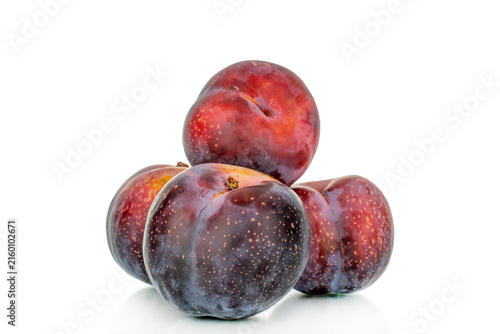 Juicy sweet plums isolated on white background, close-up.