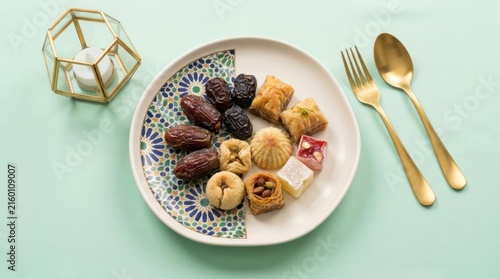 Plate of dates and sweets for Iftar meal.