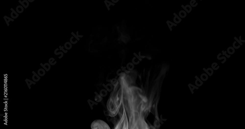 White hot steam rising slowly on a isolated black background. Real smoke or vapor curls flowing smoothly upward. Abstract slow motion mist texture overlay for video design or food background.