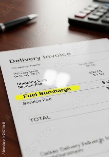 Delivery invoice with highlighted fuel surcharge on paper document. Business financial bill with shipping cost and tax fees. Concept of rising transport expense and logistics economy.