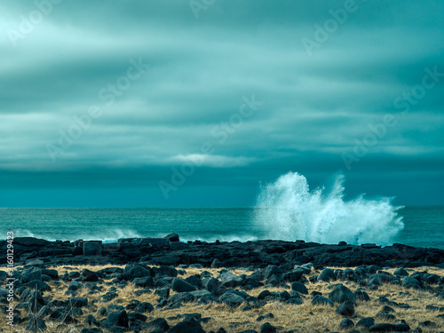 Powerful ocean wave crashing on volcanic coast in Iceland
