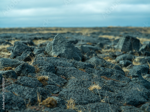 Volcanic lava rocks in barren Icelandic landscape