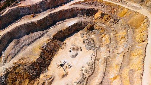 Obraz na plátně Aerial view of sand quarry pit floor with heavy machinery