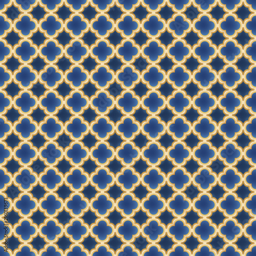 Golden quatrefoil lattice grid seamless pattern set against deep royal blue backdrop. Elegant oriental tile repeat pattern offers luxurious moroccan style for interior textiles and surface desi