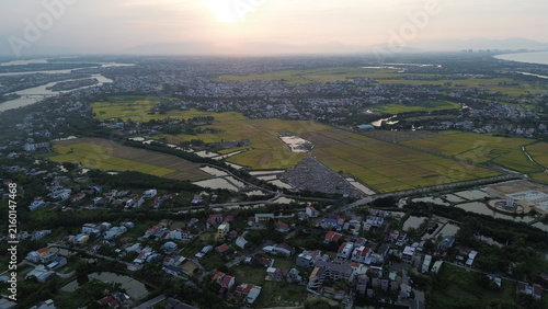 фотографія High altitude aerial view of Hoi An city and winding river tributaries in Thu Bo