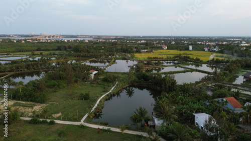High altitude aerial view of Hoi An city and winding river tributaries in Thu Bon river delta, Vietnam