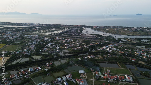 High altitude aerial view of Hoi An city and winding river tributaries in Thu Bon river delta, Vietnam