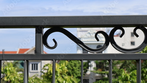 Decorative wrought iron fence detail