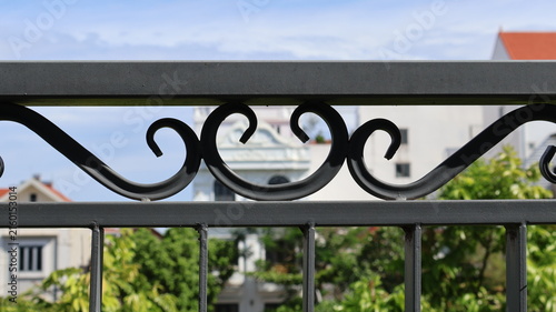 Decorative wrought iron fence detail