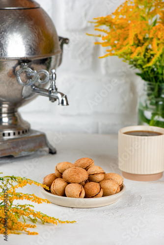 Vegan Russian style nut cookies with coconut condensed milk filling, sugar, gluten and dairy free. Vertical orientation.