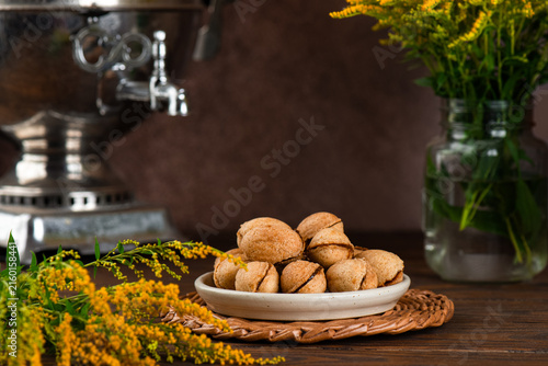 Vegan Russian style nut cookies with coconut condensed milk filling with samovar, dairy and gluten free, homemade sweet treat.