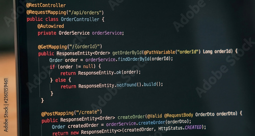 Obraz na płótnie Close-up of Java Spring backend programming code on a dark theme monitor screen