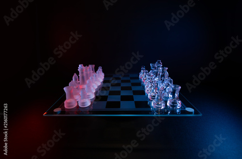 Obraz na płótnie Wide angle glass chess set with red and blue lights symbolizing game, competition, and decision-making