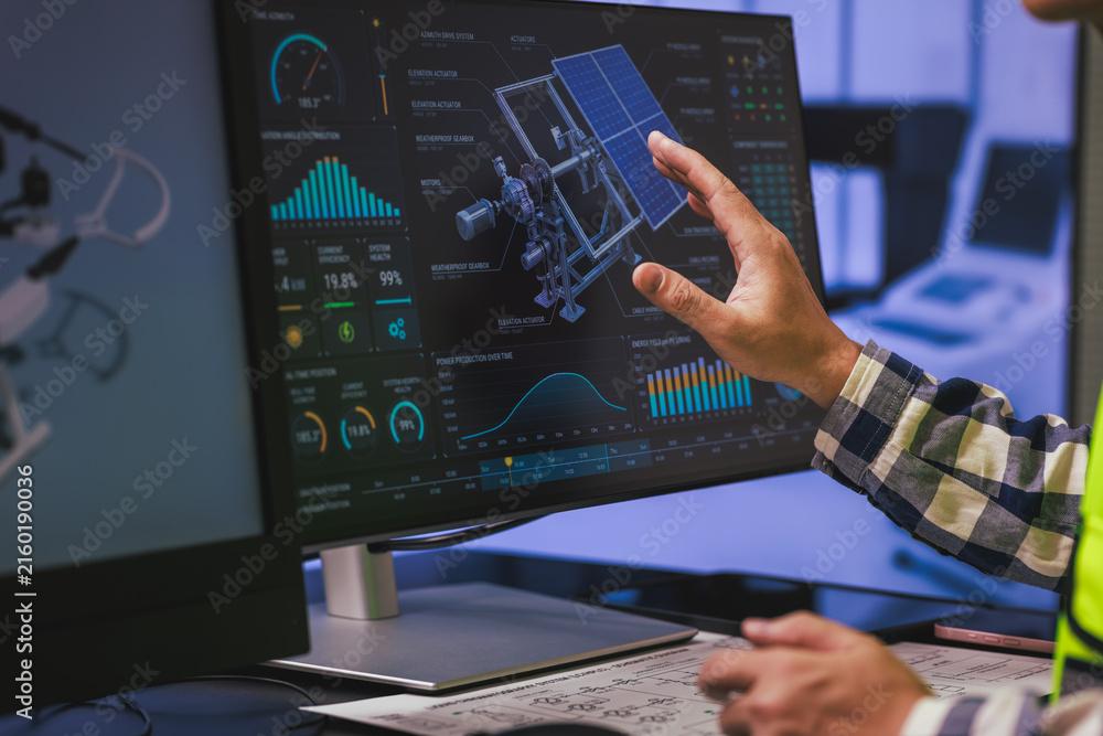Naklejka premium Hand points at a computer screen with a satellite model and data charts, space technology analysis and engineering work.