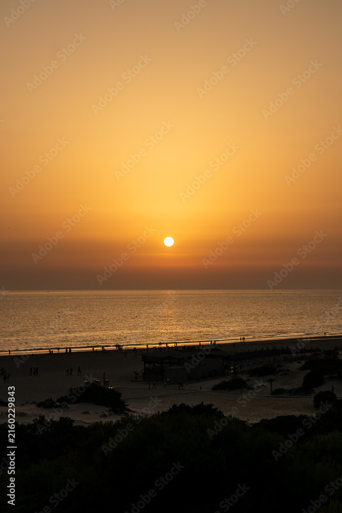 Obraz premium sunset on La Barrosa beach in Sancti Petri, Cadiz, Spain