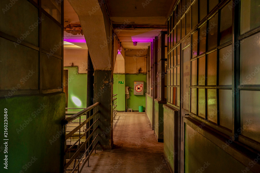 Fototapeta premium Abandoned old industrial textile research institute with laboratory chemistry glass, machinery workshop and factory hall