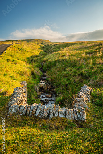 Portrait of stream on Harthorpe Moor in the North Pennines, a landscape of sweeping  moorlands, renowned for vast open skies, winding rivers and historic stone buildings in a National Landscape