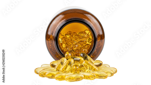фотографія Spilled amber glass medicine jar with heap of yellow translucent fish oil gel capsules represents daily nutritional supplement intake for pharmacy product marketing
