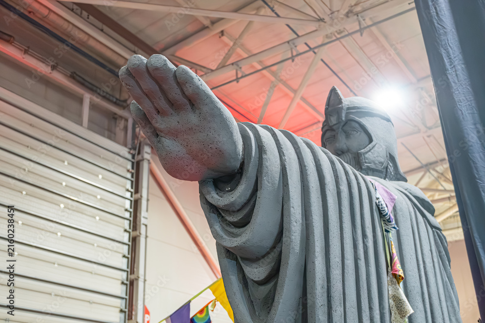 Fototapeta premium Lego figure resembling Buddha from Lord of the Rings, standing with raised hand in an industrial setting, detailed Lego construction - Kyiv, Ukraine - June 8, 2025