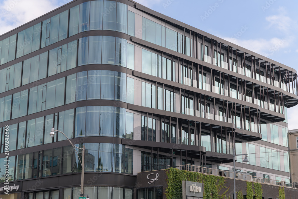 Fototapeta premium southwest corner elevation of 1133 Yonge St, an office and retail space, in the Rosedale area of Toronto