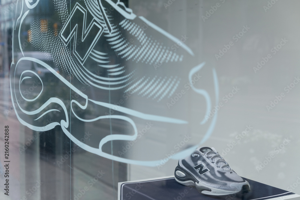 Naklejka premium window display with sportswear merchandise at New Balance store located at 1234 Yonge St, Toronto
