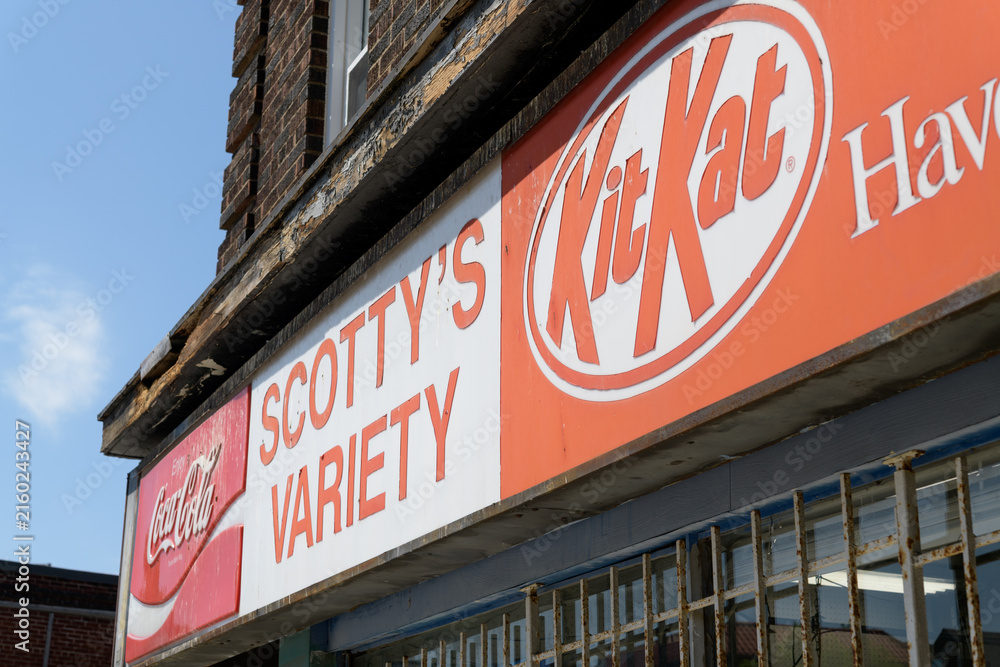 Fototapeta premium exterior building facade and vintage sign of Scotty's Variety Store, a convenience store, located at 1580 Bloor St W, Toronto