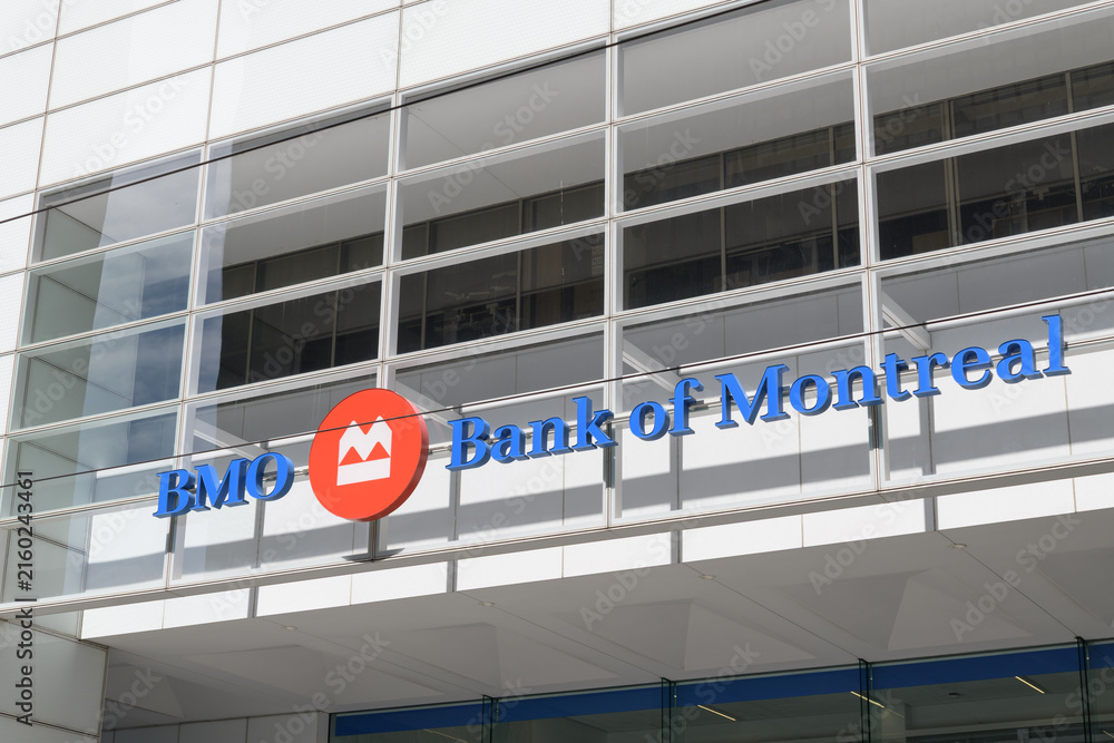 Fototapeta premium BMO corporate logo and Bank of Montreal channel lettering sign outside First Canadian Place at 100 King St W, northwest corner at Bay St, Toronto