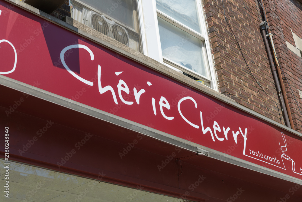 Fototapeta premium exterior building facade and sign at Cherie Cherry, a cafe, located at 1572 Bloor St W, Toronto