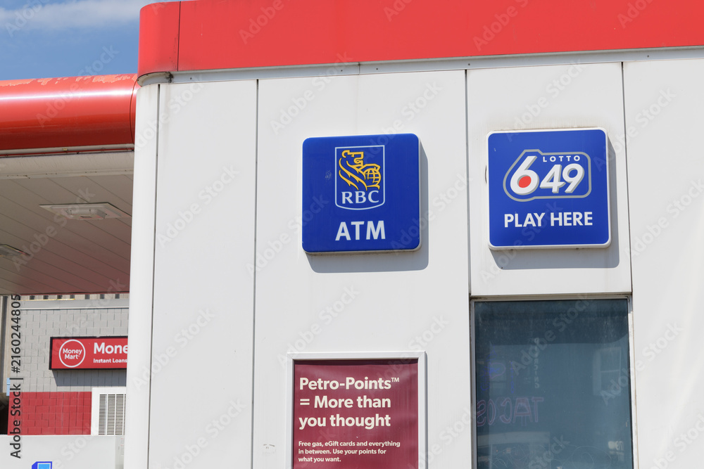Fototapeta premium RBC ATM and Loto 649 signs outside a gas station convenience store at Petro-Canada, 1750 Bloor St W, Toronto