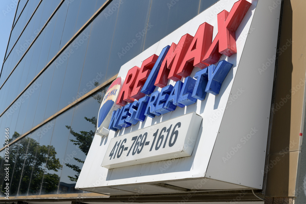 Fototapeta premium sign over entrance to Re/Max West Realty Inc, a real estate agency, located here at 1678 Bloor St W (inside The High Park Real Estate Group), Toronto