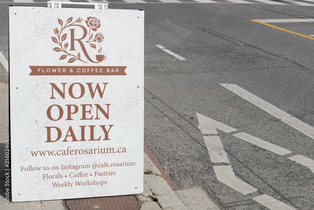 Naklejka premium a-frame sidewalk sign outside Café Rosarium located at 878 Yonge St, Toronto